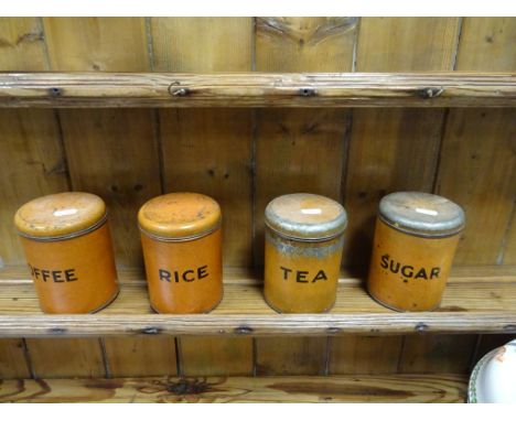 Four vintage kitchen tin jars named rice, tea, coffee & sugar