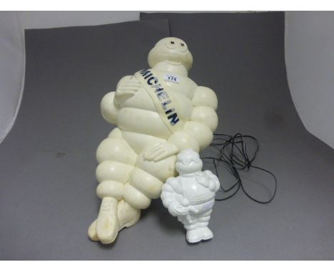 A plastic vintage Michelin man light, along with a Michelin man toy