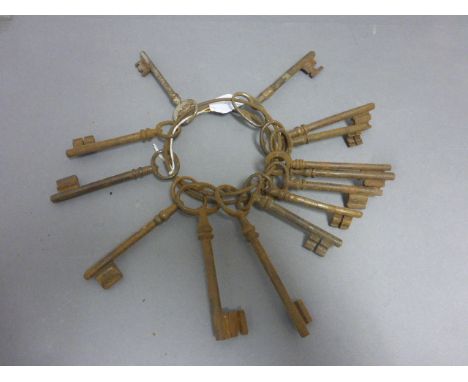 A collection keys 14 steel keys, on a ring