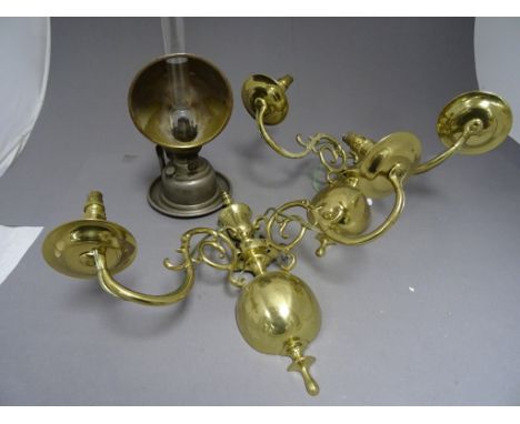 A pair of brass wall lights, along with a oil lamp with carry handle 
