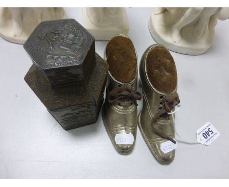 Two Large White Metal Pin Cushions in the form of Shoes together with an Oriental Metal Hexagonal Tea Caddy