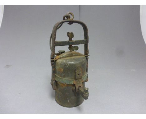 A miner's lamp with applied brass label, The premier lamp & Engineering Co, Leeds