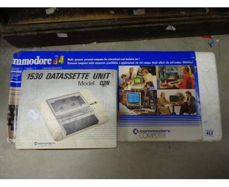 A boxed Commode 64, along with datassette unit