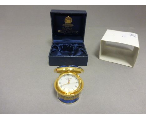 A Royal Worcester millennium clock, cased 
