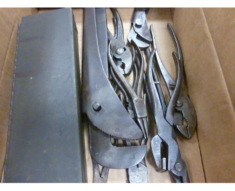 A collection of vintage tools including pliers and others items 
