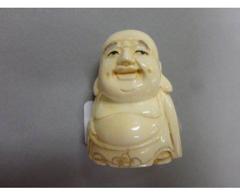 Signed oxbone netsuke of a Buddha