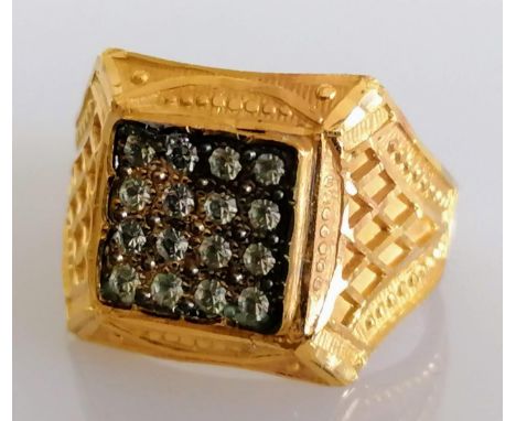 A gold signet or panel ring with twenty zircon stones on a faceted shank, unmarked, size R, tests for 22ct gold, 4.9g