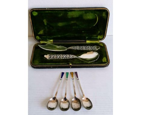 A cased George V silver spoon and fork with pierced handles by James Dixon &amp; Sons Ltd., Sheffield, 1923 and four silver c