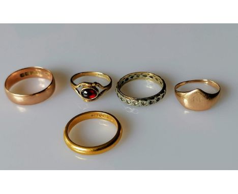 A 22ct yellow gold wedding band, 3mm, size R, hallmarked, 6.31g and four other 9ct yellow and rose gold rings, two gem-set, s