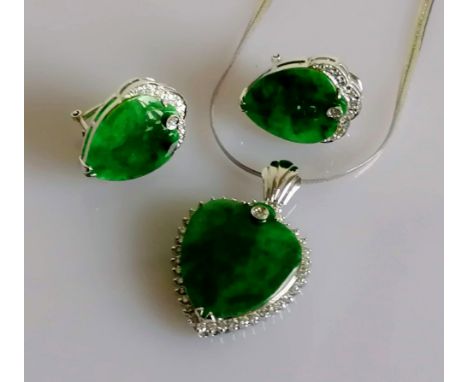 A jade parure necklace heart-pendant, 25mm x 21mm and matching earrings, each 20mm x 15mm on 18ct white gold and diamond deco