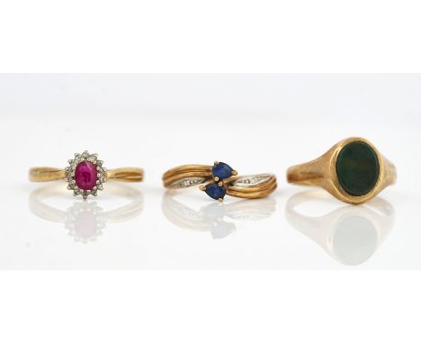 THREE 9CT GOLD AND GEM SET RINGS (3)Comprising; a ruby and diamond oval cluster ring, ring size P and a half, a sapphire and 
