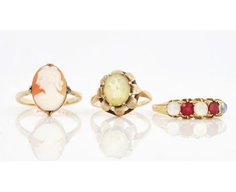 AN 18CT GOLD MOONSTONE AND RED GEM SET RING AND TWO FURTHER RINGS (3)The 18ct gold ring mounted with three moonstones alterna