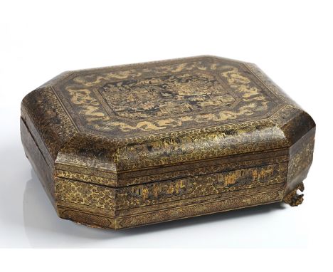 A CHINESE EXPORT GILT AND BLACK LACQUER GAMES BOXEarly 19th centuryOf octagonal form, raised on four paw feet, the cover gilt