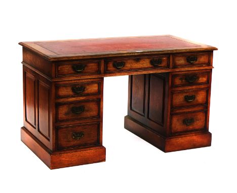 A 20TH CENTURY OAK PEDESTAL DESKWith nine drawers about the knee, 129cm wide; 69cm deepDesk in good structural condition, lea