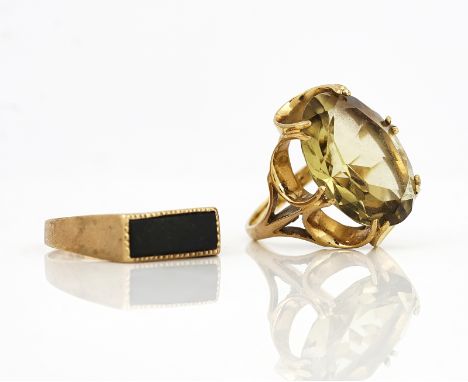 TWO 9CT GOLD AND GEM SET RINGS (3)Comprising; a 9ct gold ring claw set with an oval cut citrine, ring size K and a half and a