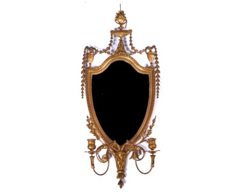 A LATE 19TH CENTURY SHIELD SHAPED GIRONDAL MIRRORWith urn finial decoration, 43cm wide; 103cm high