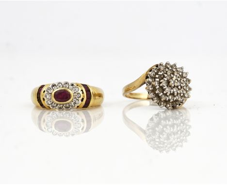 A GOLD RUBY AND DIAMOND RING AND A DIAMOND CLUSTER RING (2)The gold, ruby and diamond ring mounted with the principal oval cu