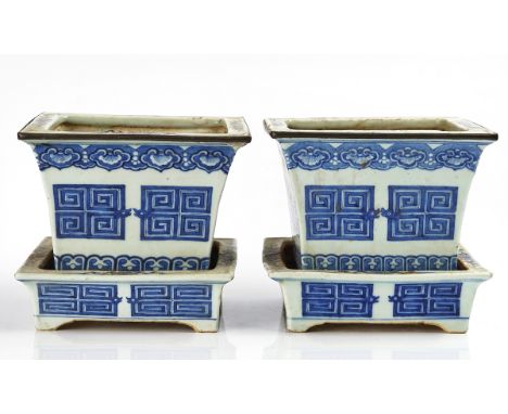 A PAIR OF CHINESE BLUE AND WHITE JARDINIERES AND STANDSLate 19th centuryOf flared square section, painted with key pattern be