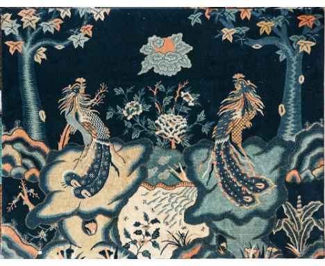 A CHINESE WOOL CARPET SECTIONNingxia province, late 19th/early 20th centuryThe blue wool rectangular section with two long-ta