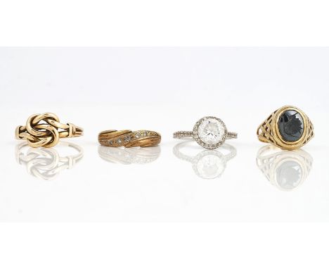 FOUR GOLD RINGS (4)Comprising; a gold ring in a woven knot design, detailed indistinctly 18, ring size S, weight 4.1 gms, a 9