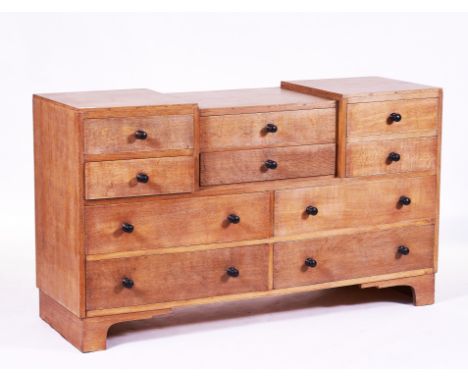 HEAL’S; A LIMED OAK SIDE CABINETWith an arrangement of 10 drawers, 151cm wide; 48cm deep;  88cm highCondition report:Good ove