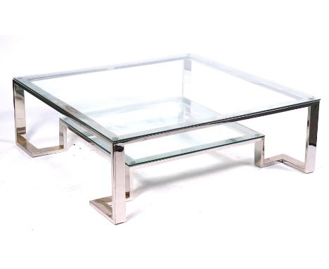 A LARGE 20TH CENTURY SQUARE GLASS TOPPED COFFEE TABLEOn polished nickel plated base with undertier, 120cm wide; 40cm high