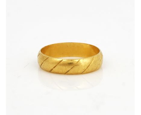 A 22CT GOLD DECORATED WEDDING RINGLondon 1967, ring size N, weight 4.1 gms