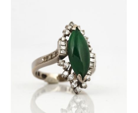 A WHITE GOLD, JADE AND DIAMOND RINGMounted with a central marquise shaped jade and otherwise set with circular cut and baguet