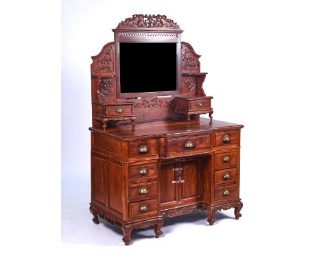 A LATE 19TH CENTURY CHINESE EXPORT HARDWOOD DRESSING TABLEWith swing frame mirror over an arrangement of drawers, 121cm wide;