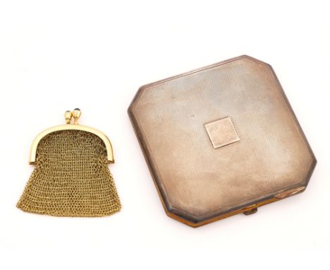 A GOLD CHAIN MESH COIN PURSE AND A LADY'S SILVER POWDER COMPACT (2)The gold purse with a curved top mount, with a cabochon da