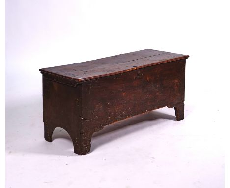 A 17TH CENTURY ELM PLANK COFFEROn bracket feet, 109cm wide; 51cm high