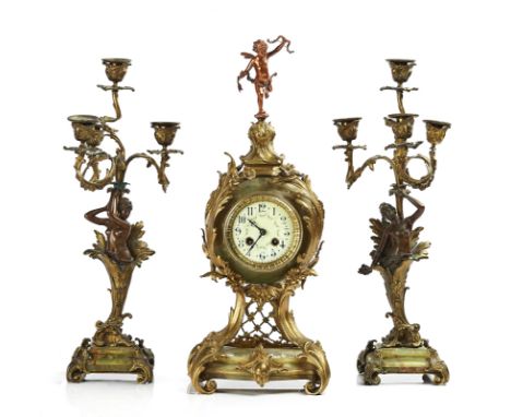 A GILT-METAL AND ONYX THREE-PIECE MANTEL CLOCK GARNITURELate 19th / Early 20th CenturyThe clock with a twin train brass drum 