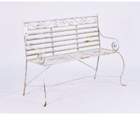 A WHITE PAINTED REGENCY STYLE WROUGHT IRON GARDEN BENCHWith scroll arm supports 122cm wide; 92cm high