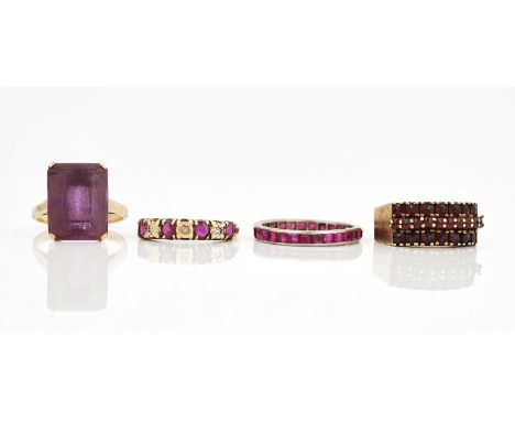 FOUR GEM SET RINGS (4)Comprising; a gold ring, claw set with a rectangular step cut amethyst, detailed 9 CT, ring size O, a 9