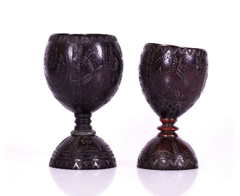 TWO CARVED COCONUT CUPS19th CenturyThe largest carved with a Scottish thistle, palm tree and two flags, 18.5cm high, the othe