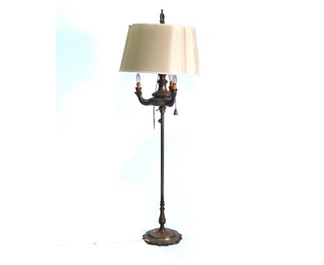 A SILVERED METAL STANDARD LAMP20th CenturyIn the Greek style, the reservoir with three implements attached by chains to inclu