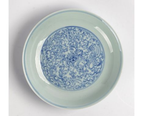 A CHINESE BLUE AND WHITE DISHProbably modernPainted with a panel of lotus flowers and tendrils, repeated on the underside, ap