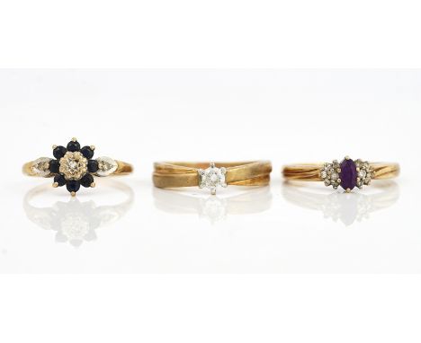 THREE 9CT GOLD AND GEM SET RINGS (3)Comprising; a sapphire and diamond nine stone cluster ring with diamond set shoulders, ri