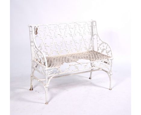 IN THE MANNER OF VAL D’OSNEA white painted cast iron garden bench in the Gothic pattern, 100cm wide; 90cm high