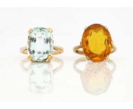 A GOLD RING, CLAW SET WITH A CUSHION SHAPED AQUAMARINE AND ANOTHER GOLD RING (2)The aquamarine ring detailed 9 CT, ring size 