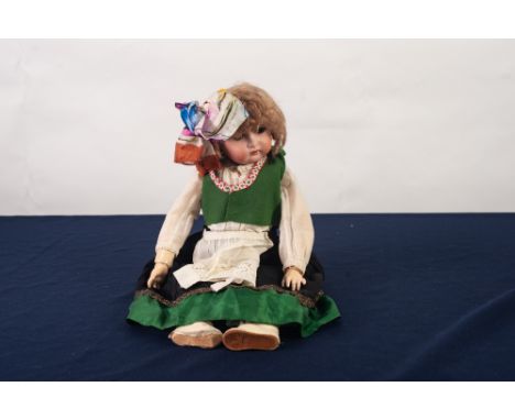 KAMMER AND REINHARDT,  GERMAN GIRL CHARACTER DOLL, with socketed bisque head, brown glass sleeping eyes, open mouth with four