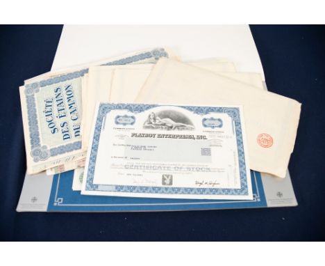 UNION BANK OF SWITZERLAND 1981 CALENDAR with 6 tipped-in genuine SHARE CERTIFICATES and approximately 25 other LOOSE SHARE CE