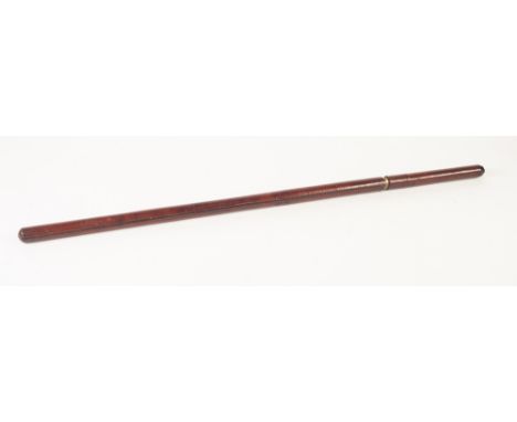 EARLY TWENTIETH CENTURY SHORT SWORDSTICK, MADE AS A STITCHED BROWN LEATHER SWAGGER STICK, the pointed blade plated and with e