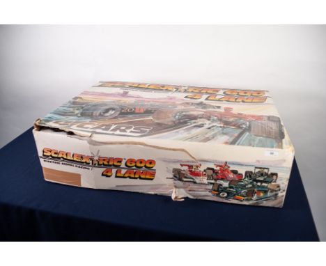 CIRCA 1982 SCALEXTRIC 600 GRAND PRIX BOXED RACING CAR SET four track with four cars and control handsets, lap counter, pamphl