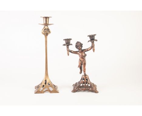 ARTS AND CRAFTS BRASS CANDLESTICK, with pierced square base, 14" (35.6cm) high, together with a PIERCED COPPER TWO LIGHT CAND