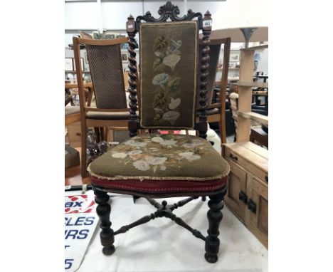 A Victorian mahogany chair with tapestry seat and back