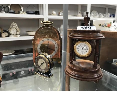 A brass front clock and 2 others