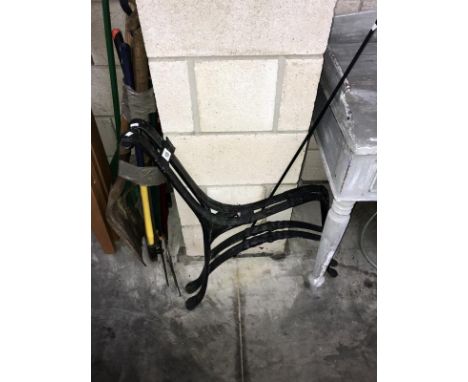 A pair of cast iron bench ends