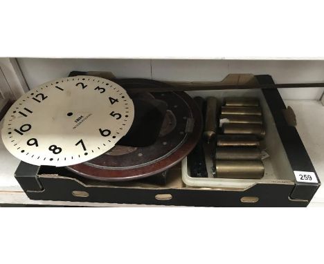A selection of brass regulator weight, an IBM international clock face etc.