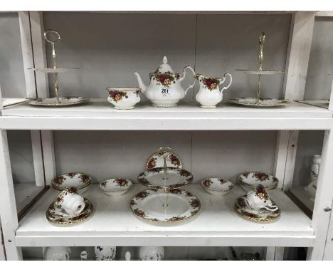 2 shelves of Royal Albert Old Country Roses including cake stands, teapot etc.